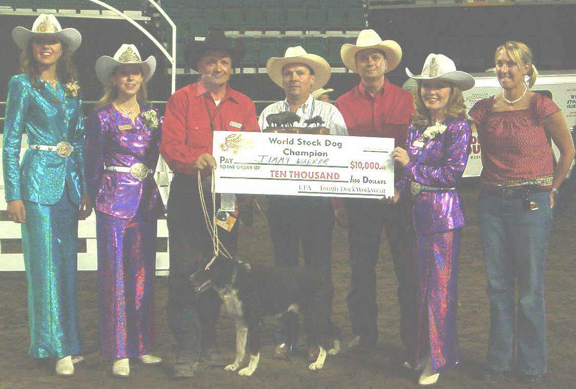 Jimmy Walker receiving the first place award with Ben, winner of the Calgary Stampede World Stockdog Championship