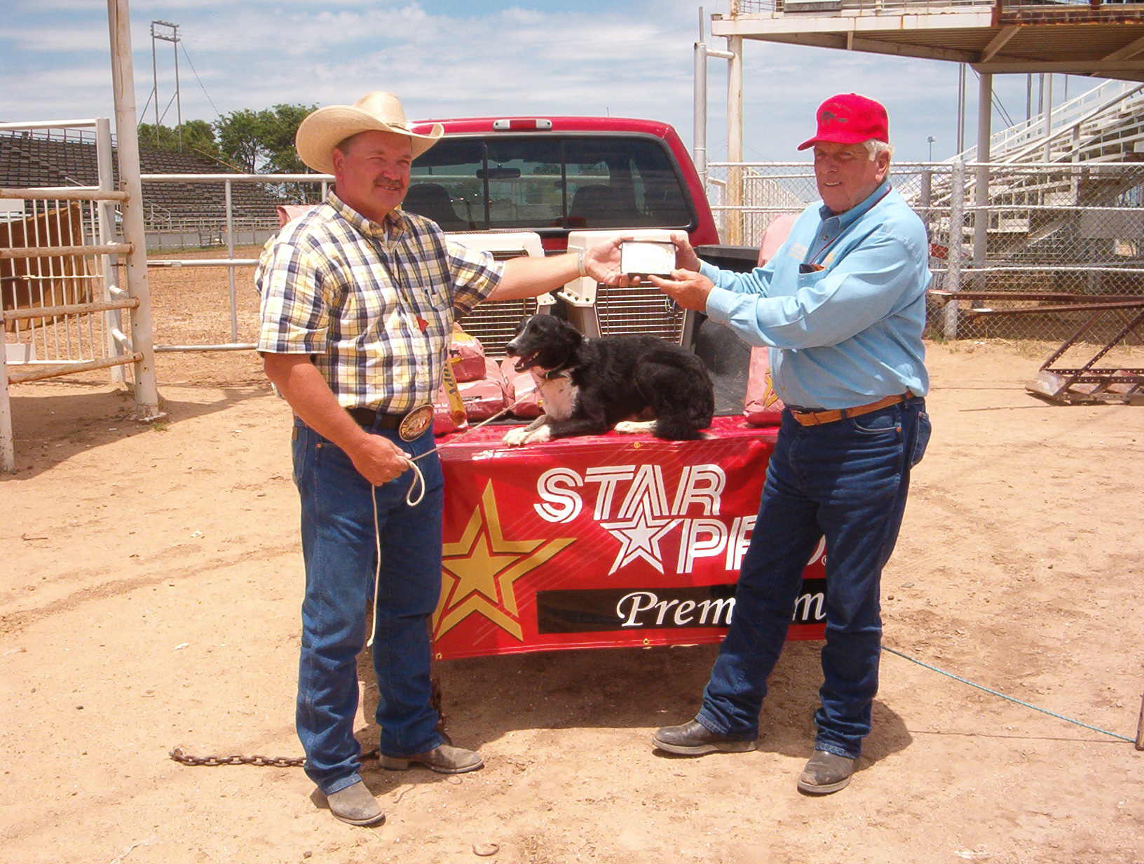 Ben being presented the belt buckle after winning the Open at the Top of Texas Cattle Dog Trial in Pampa, Texas